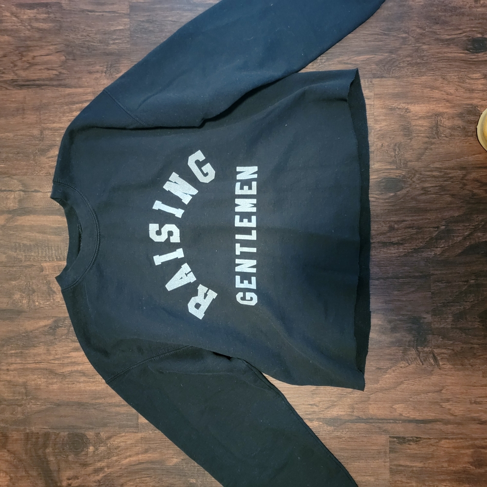 Black sweatshirt with white text and crew neck design